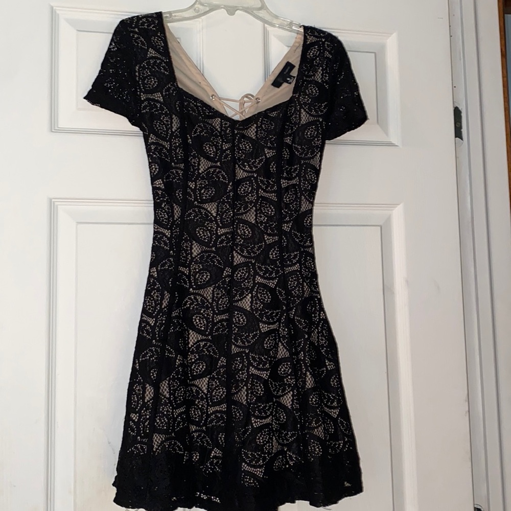 Black lace romper with nude slip